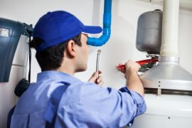 Plumber repairing an hot-water heater Plumber Santa Monica